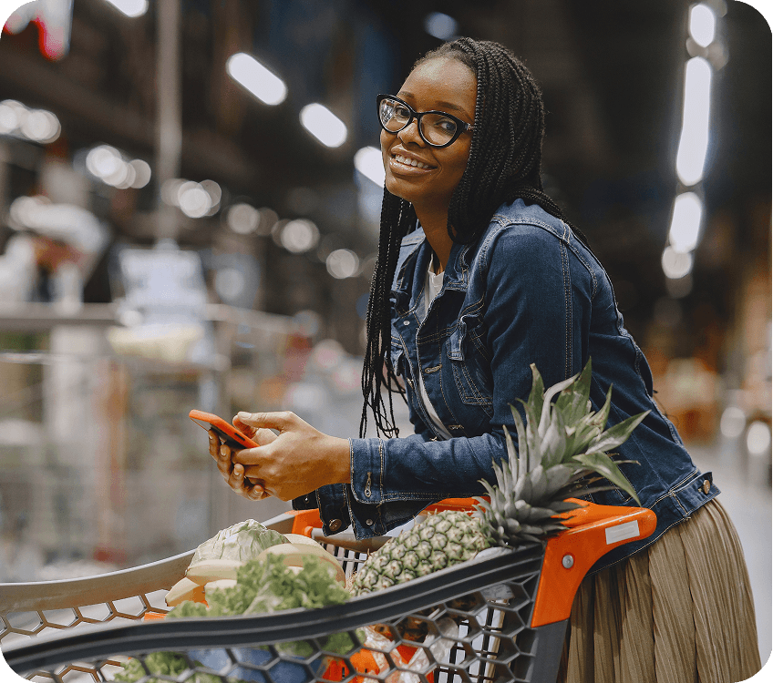 Woman shopping with a cart at the market