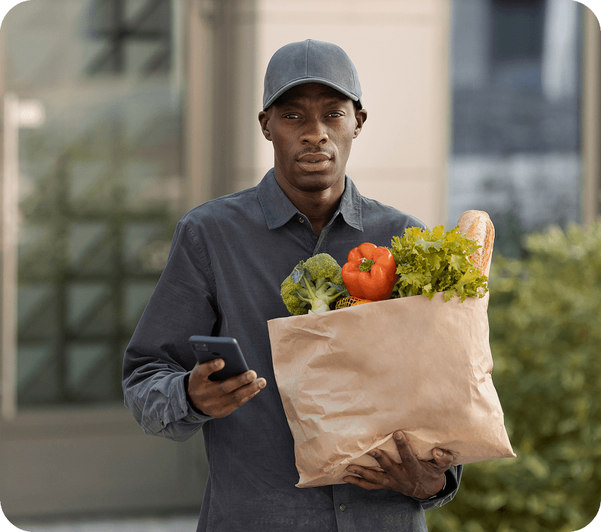 Agent holding grocery bag