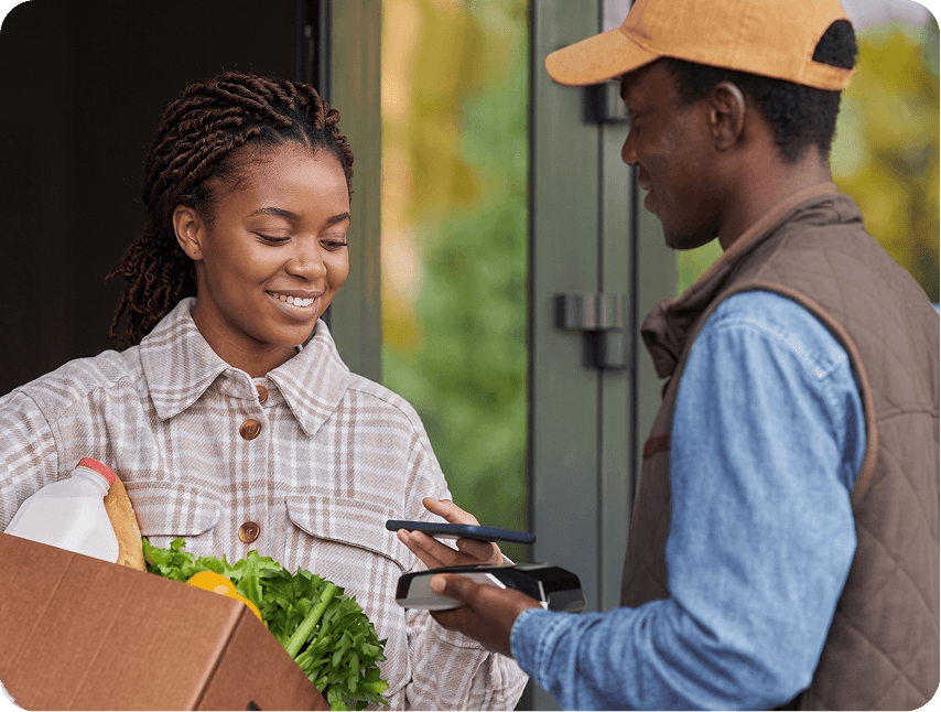 Agent handing over a grocery box